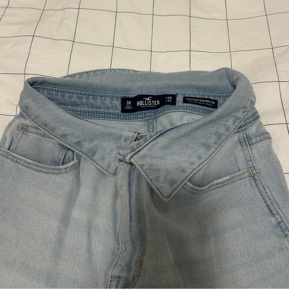 Hollister light wash mom jean with waist detail.